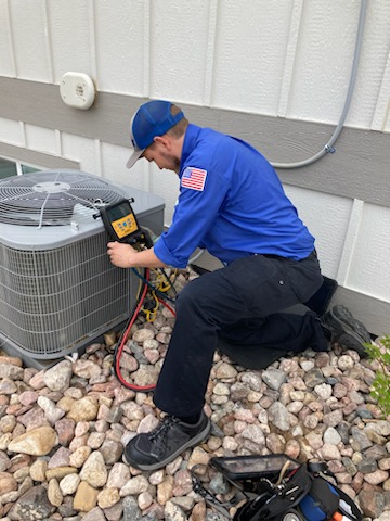 HVAC tech checking AC