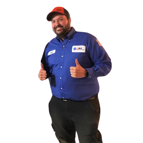 Friendly HVAC technician wearing blue IMS work shirt and red cap giving thumbs up gesture.